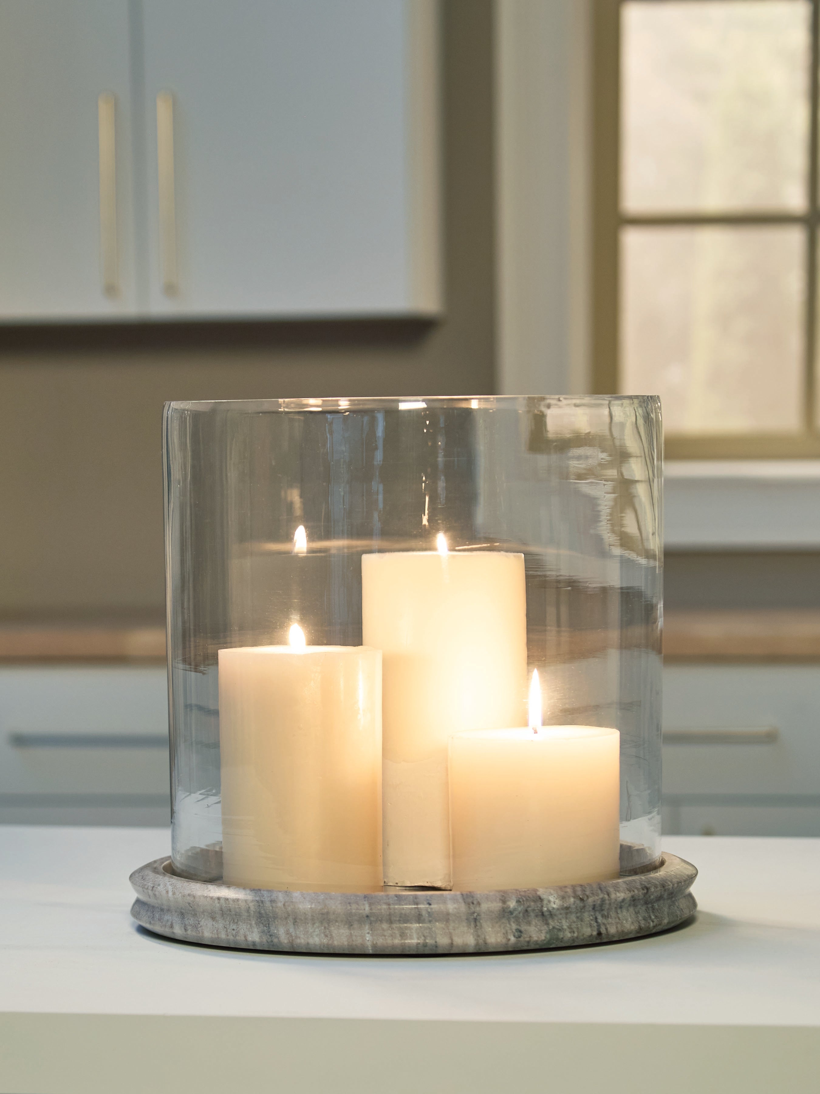 Lullora Furniture - Ashley Furniture - Saskia Candle Holder - Candle Holder / Clear/Beige - A2000847