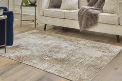 Lullora Furniture - Ashley Furniture - Grifflain Rug - 5'1" x 7' Washable Rug / Tan/Brown/Gray - R406232