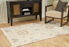 Lullora Furniture - Ashley Furniture - Calkin Rug - 5' x 7' Rug / Linen/Gray/Caramel - R406392