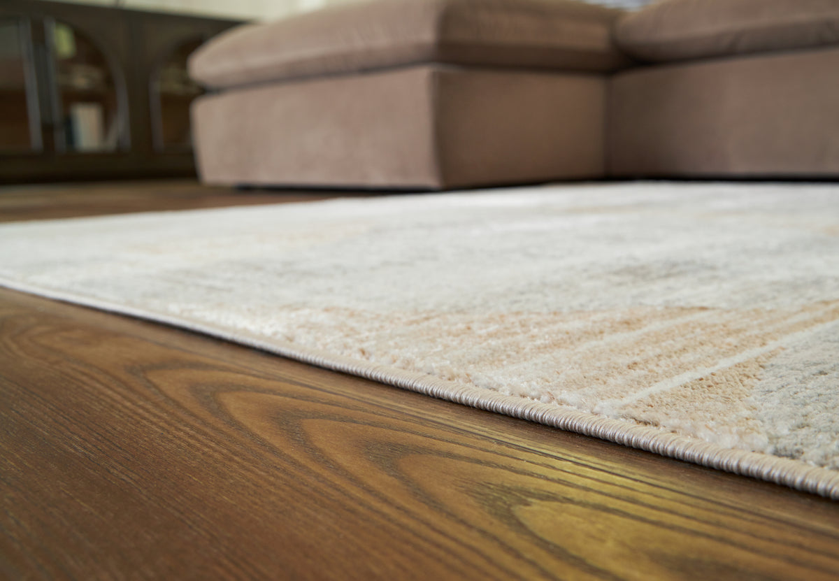 Lullora Furniture - Ashley Furniture - Truward Rug - 5' x 7' Rug / Linen/Gray/Caramel - R406472