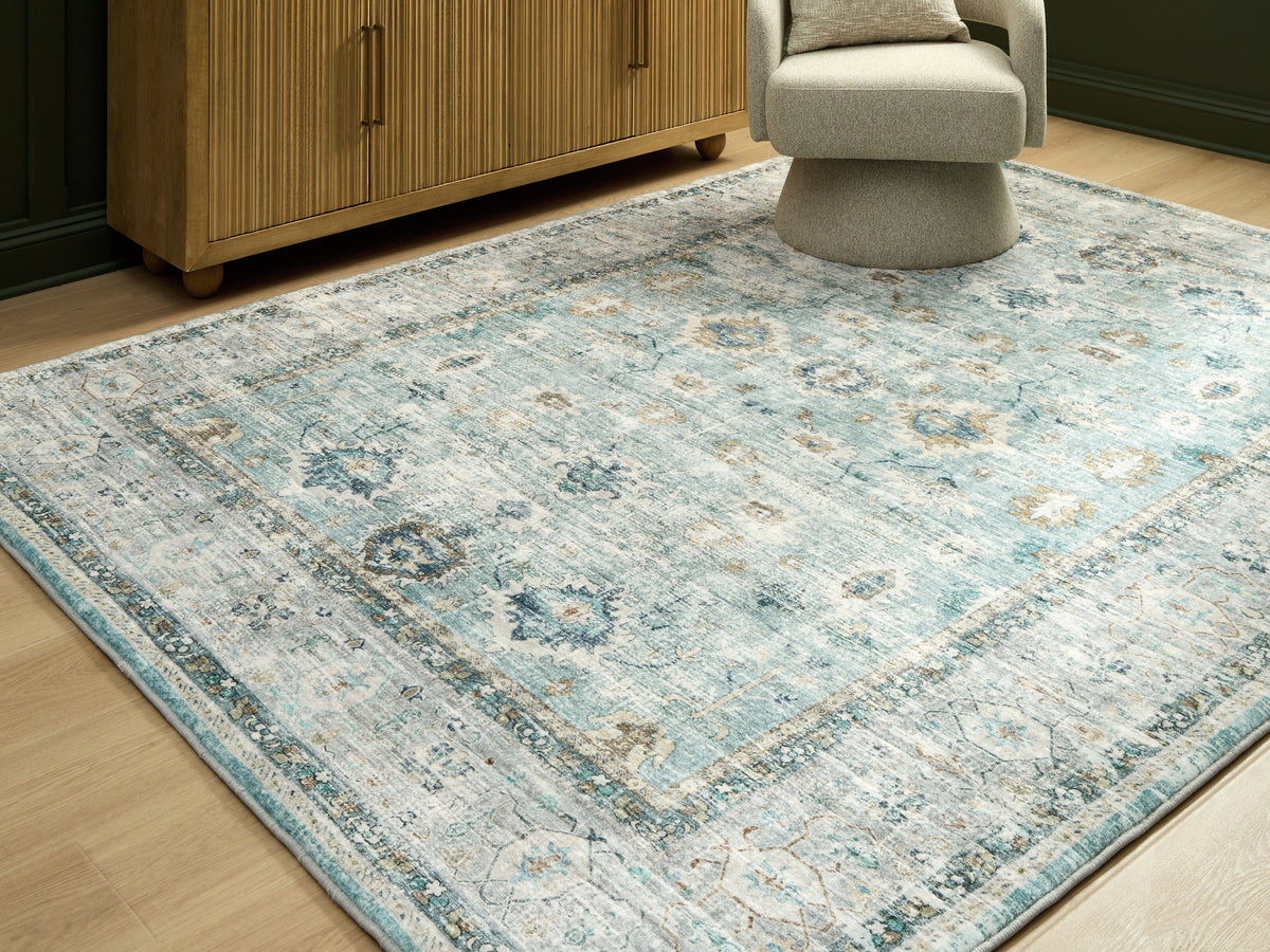 Lullora Furniture - Ashley Furniture - Ladstoney Rug - 7'6" x 9'6" Area Rug / Teal/Beige/Ochre - R407501