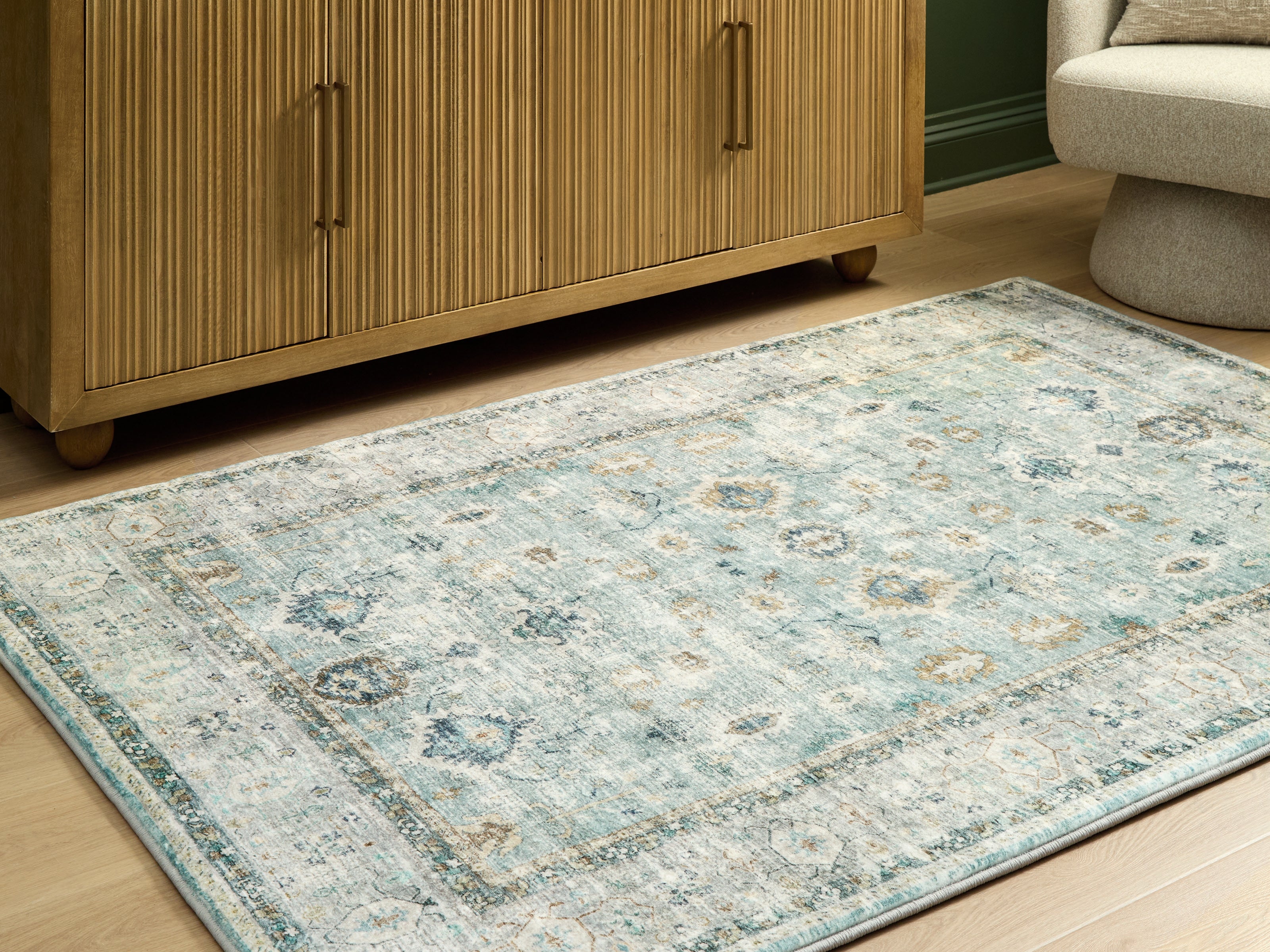 Lullora Furniture - Ashley Furniture - Ladstoney Rug - 5' x 7' Area Rug / Teal/Beige/Ochre - R407502