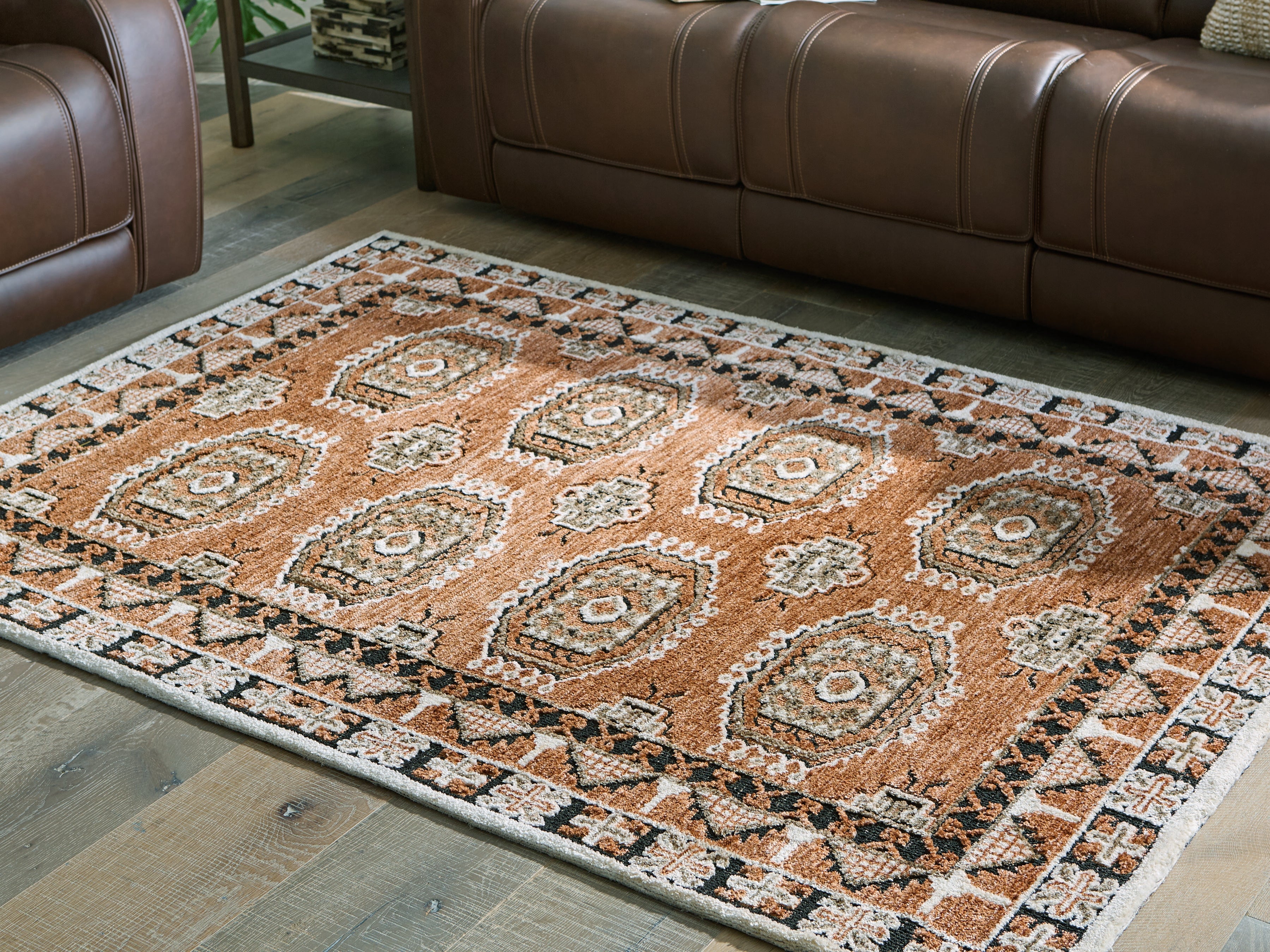 Lullora Furniture - Ashley Furniture - Qaabiz Rug - 7'8" x 10' Area Rug / Sienna/Ivory/Black - R407521