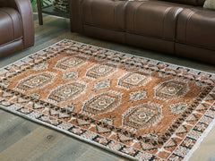 Lullora Furniture - Ashley Furniture - Qaabiz Rug - 7'8" x 10' Area Rug / Sienna/Ivory/Black - R407521