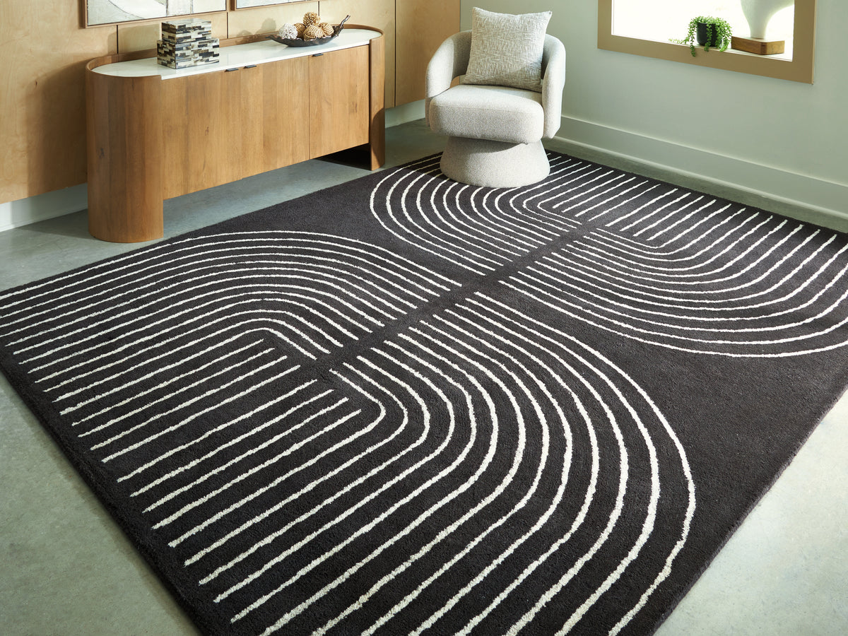 Lullora Furniture - Ashley Furniture - Eldonmore Rug - 5' x 7' Area Rug / Black/Ivory - R407572