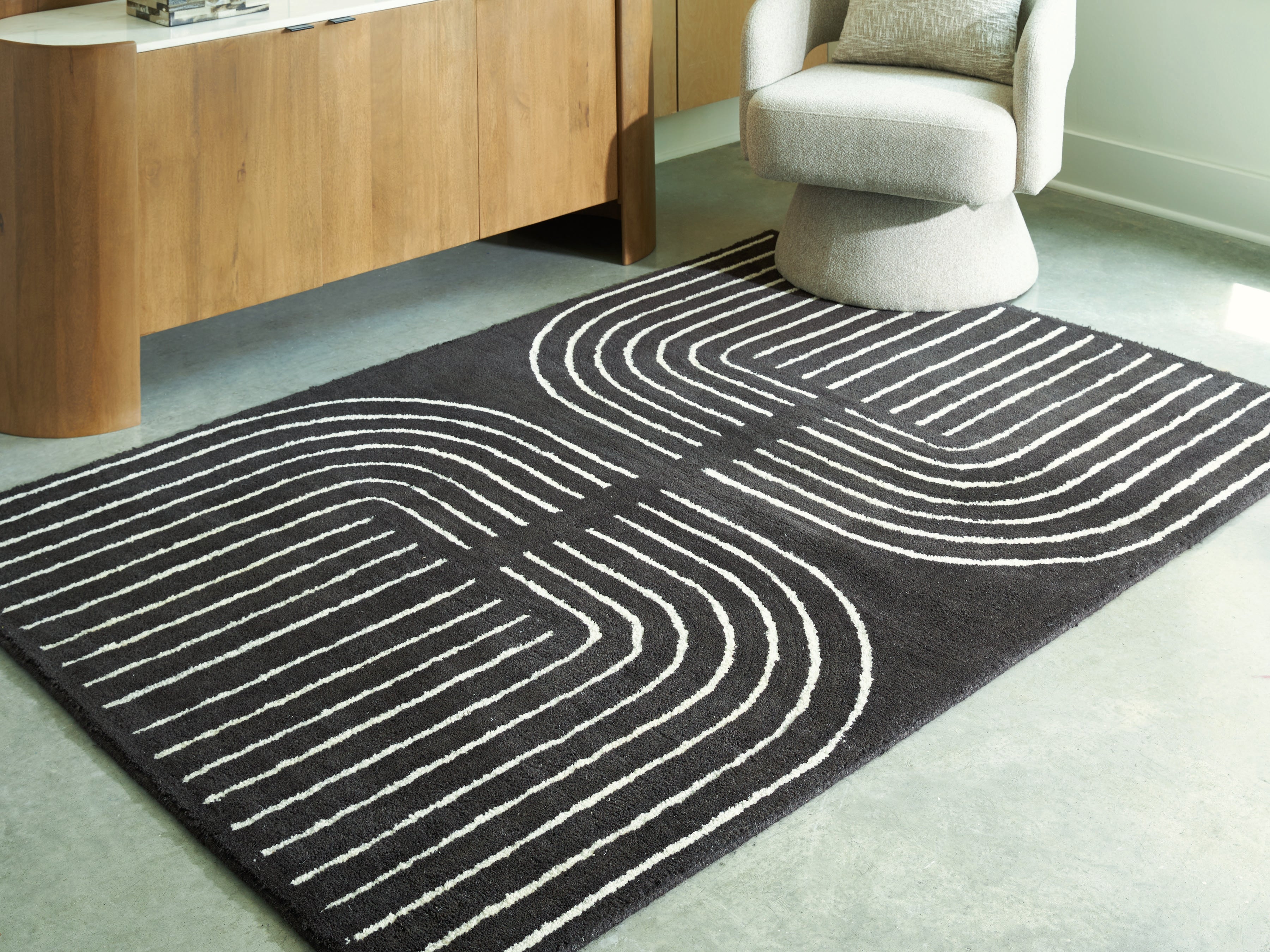Lullora Furniture - Ashley Furniture - Eldonmore Rug - 5' x 7' Area Rug / Black/Ivory - R407572