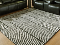 Lullora Furniture - Ashley Furniture - Kurtmen Rug - 5' x 7' Area Rug / Black/Ivory - R407592