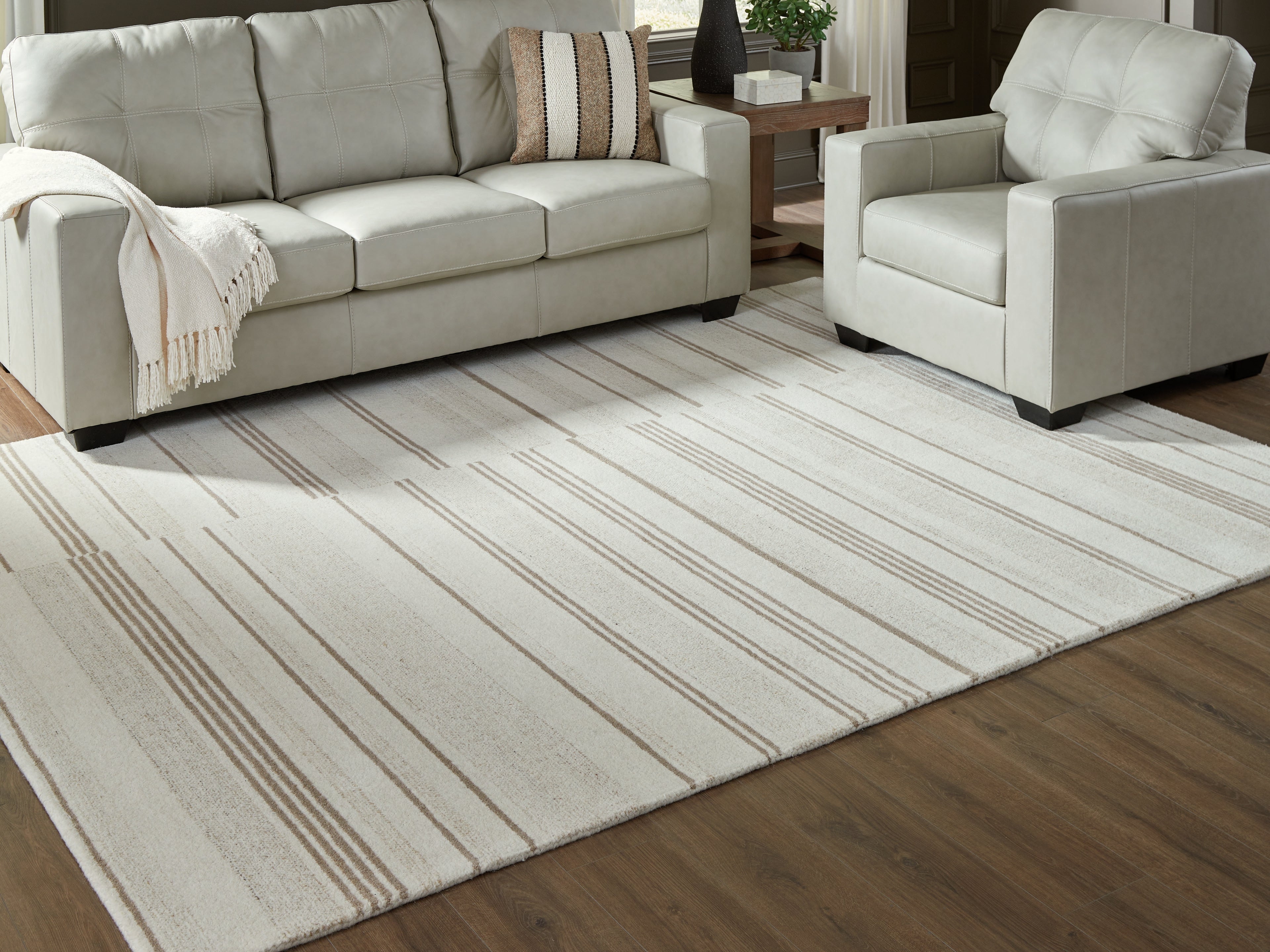 Lullora Furniture - Ashley Furniture - Gadence Rug - 7'8" x 10' Area Rug / Ivory/Tan - R407641
