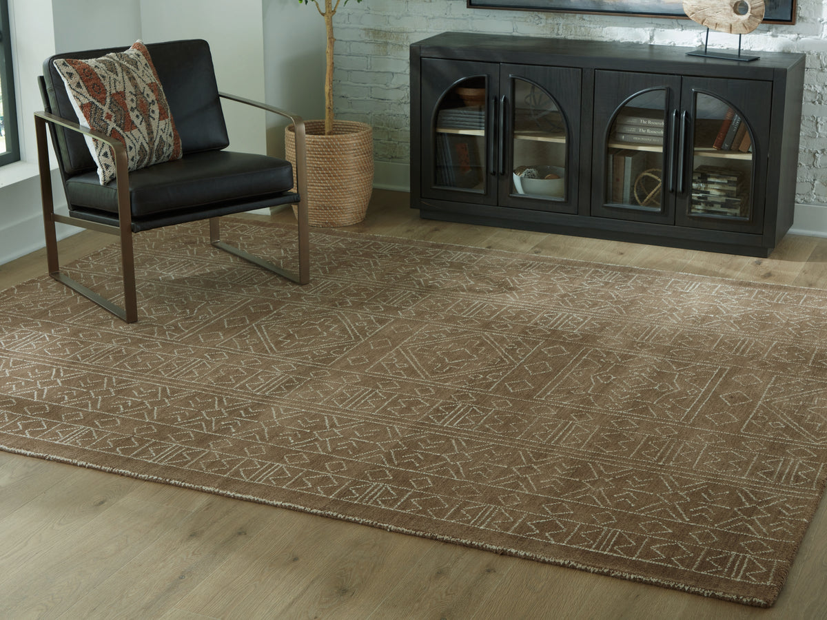 Lullora Furniture - Ashley Furniture - Merrittman Rug - 5' x 7' Area Rug / Brown/Ivory - R407702