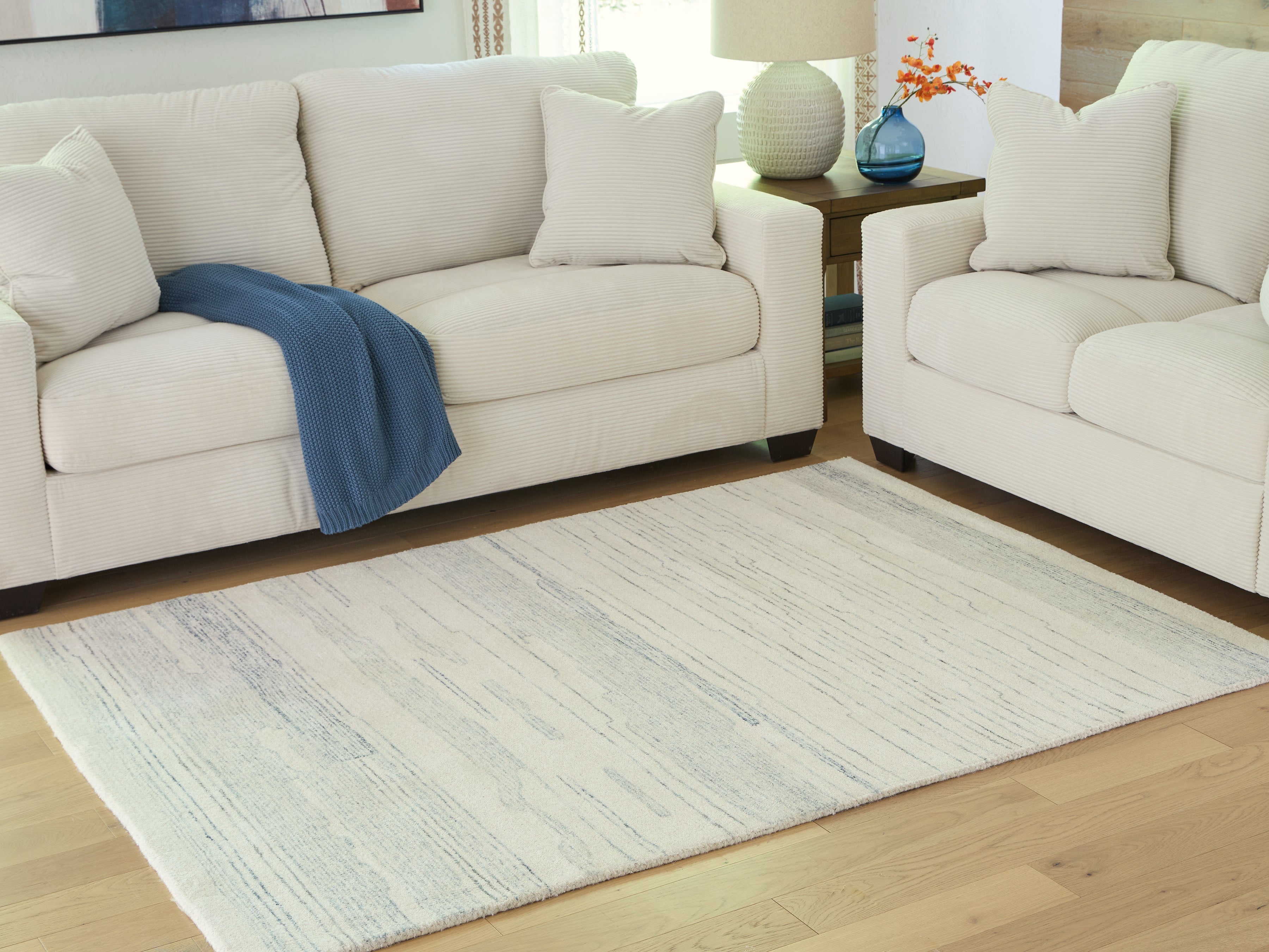 Lullora Furniture - Ashley Furniture - Genemost Rug - 5' x 7' Area Rug / Ivory/Blue - R407842