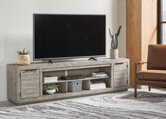 Lullora Furniture - Ashley Furniture - Naydell 92" TV Stand - 92" / Gray - W996-78